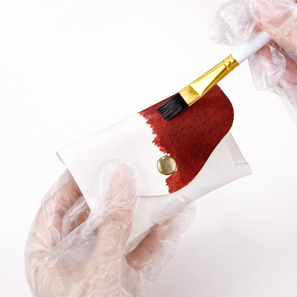 Alt: "hand dyeing full grain leather brush Raonero India craft"